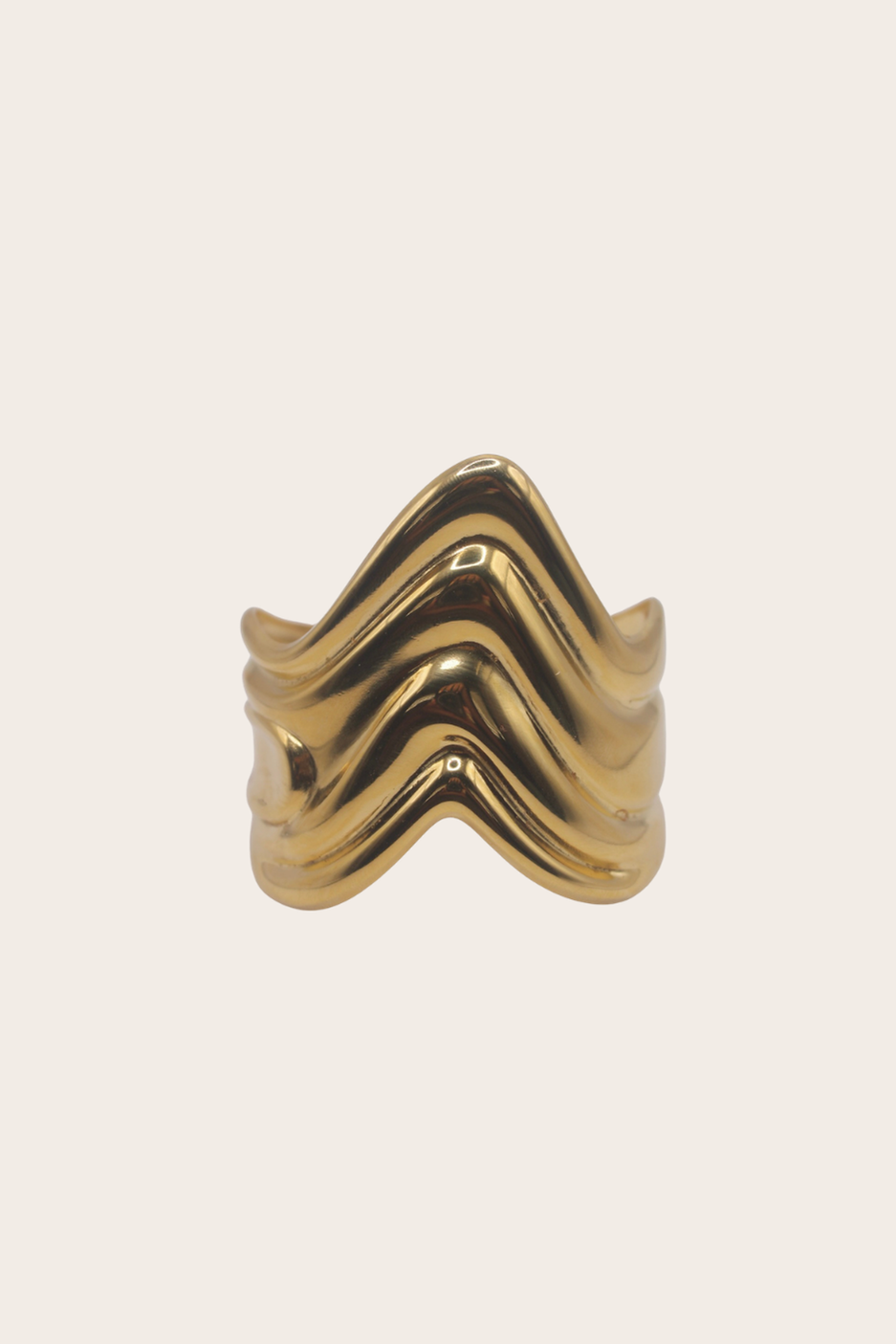 Kai Cuff featuring a sculptural cuff with flowing wave-like bands