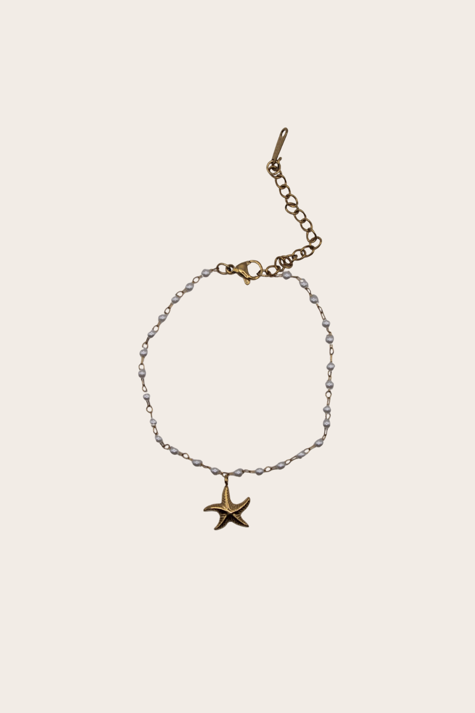 Pearls Starfish Bracelet featuring pearl-style accents with a centered starfish charm