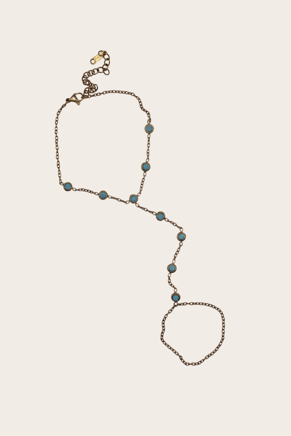 Turquoise Hand Chain featuring a bracelet-to-ring chain with turquoise accents
