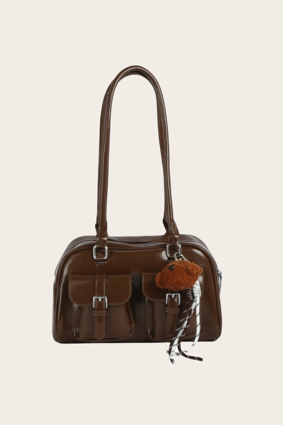 Brown Double Pocket Bag, brown shoulder bag featuring a double-pocket design with an included bag charm