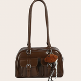 Brown Double Pocket Bag, brown shoulder bag featuring a double-pocket design with an included bag charm