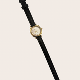 Samira Black Watch, gold and black watch featuring a bold black-and-gold combination with a polished watch silhouette