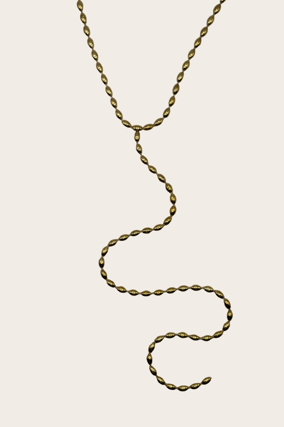 Kalena Lariat, gold necklace with a delicate lariat silhouette with a long drop detail