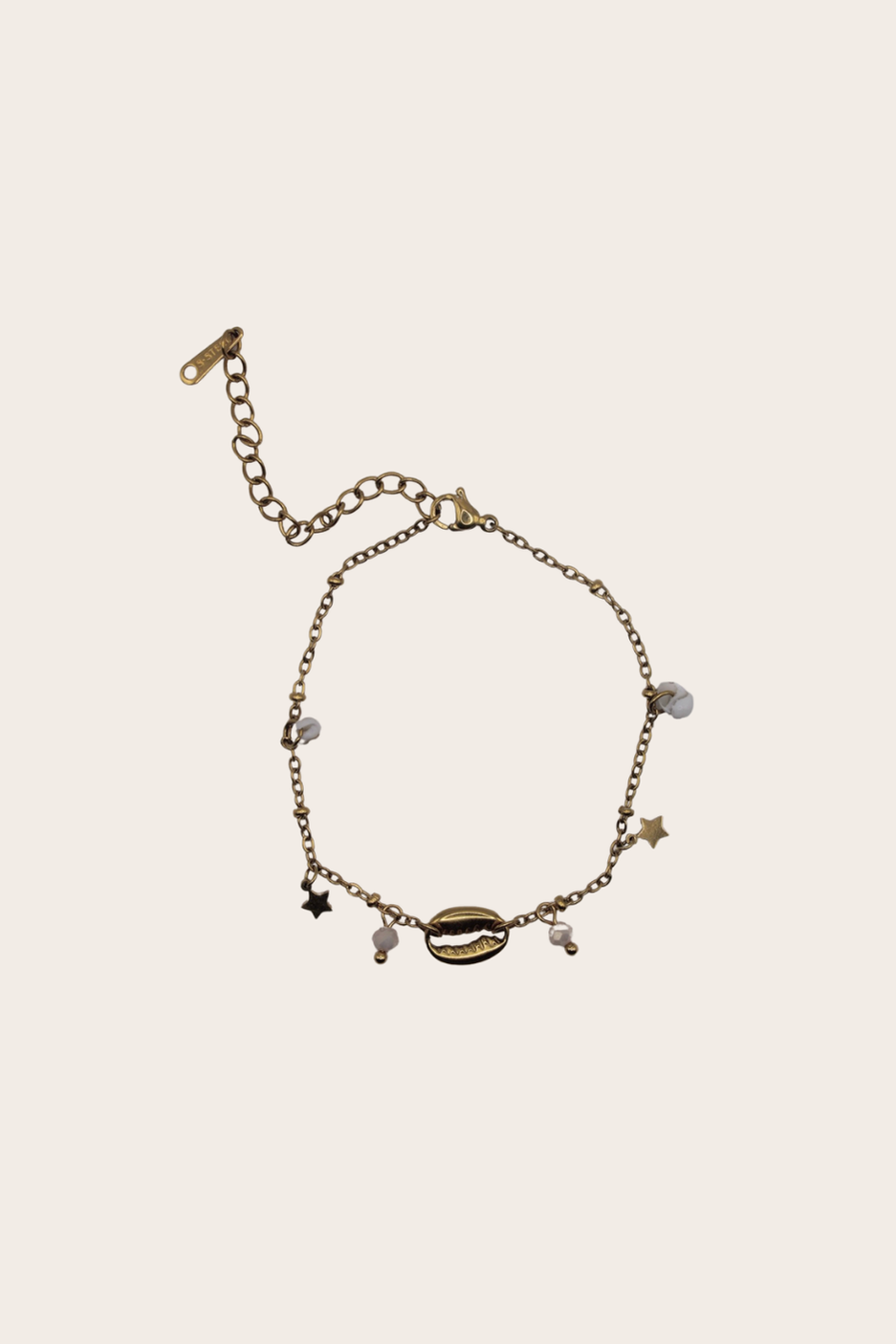 Summer Cowrie Bracelet featuring a delicate chain with a centered cowrie shell charm