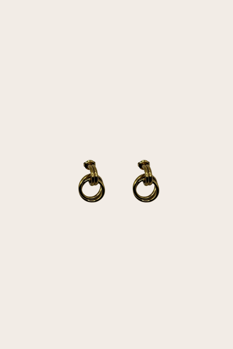 Frances Earrings, gold earrings with a polished golden silhouette designed to frame the face with modern presence