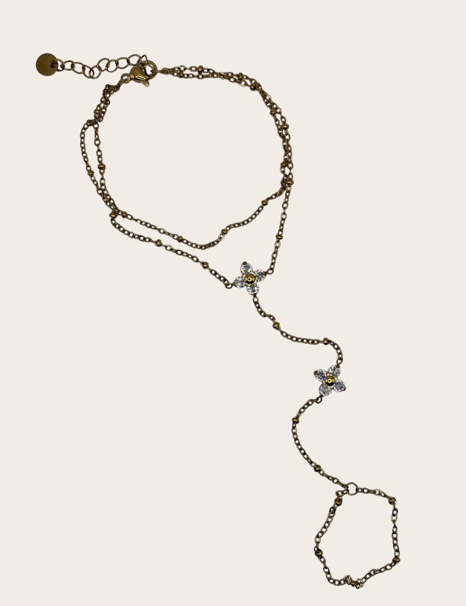 Stainless steel hand chain featuring two clover-inspired accents