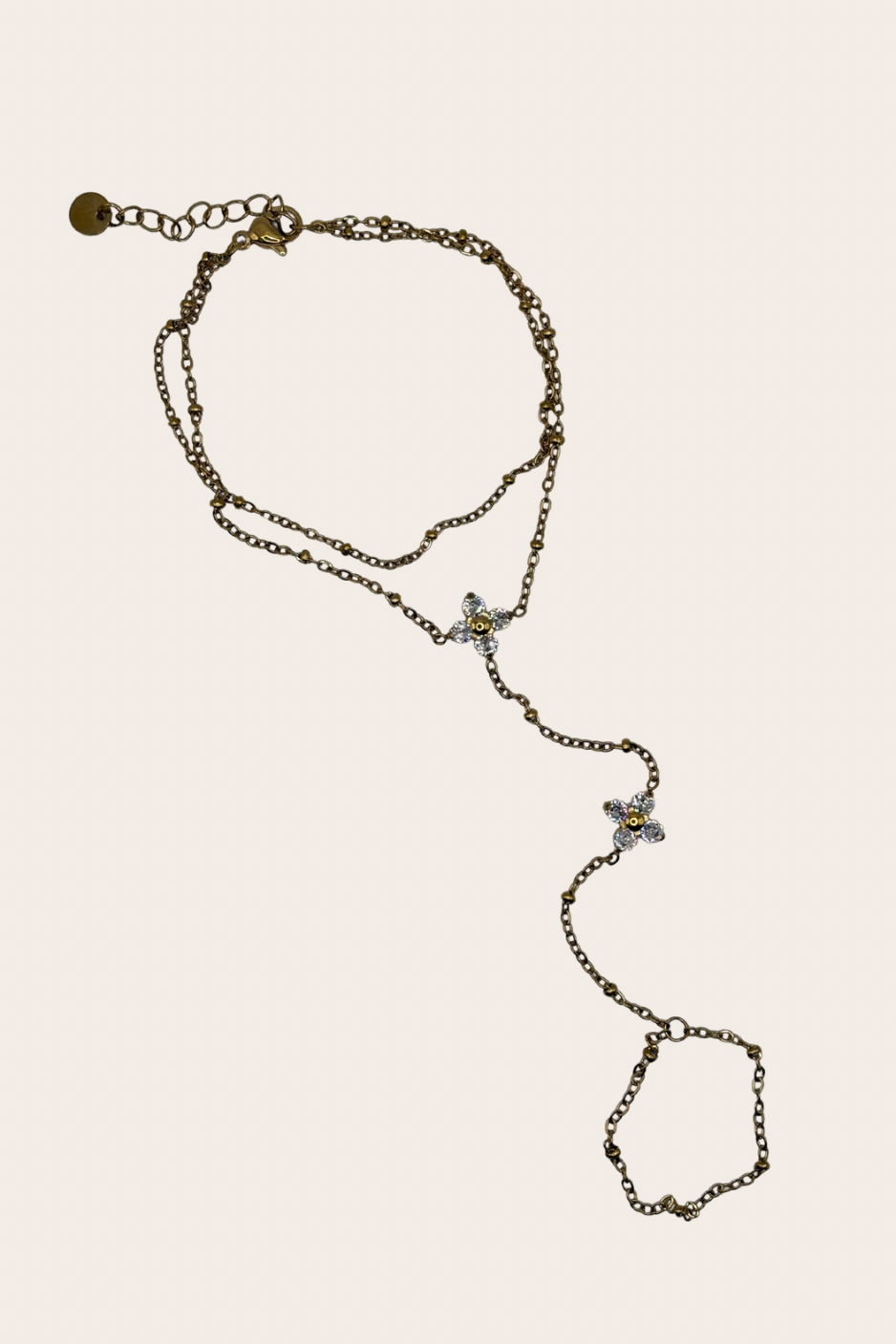 Stainless steel hand chain featuring two clover-inspired accents