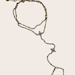 Stainless steel hand chain featuring two clover-inspired accents