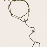 Stainless steel hand chain featuring two clover-inspired accents