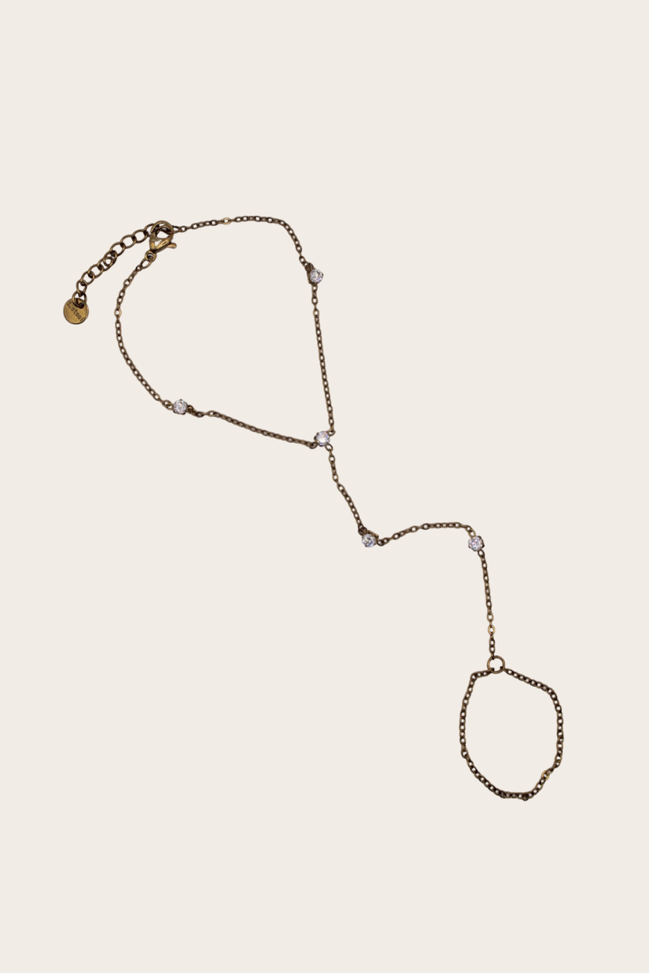 Daniella Diamonds Hand Chain featuring a bracelet-to-ring chain with delicate crystal-style stations