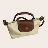 Beige Small Top Handle Bag, beige top handle bag featuring a compact nylon silhouette with an included strap
