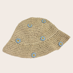 Woven straw hat decorated with feminine blue floral details