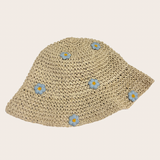 Woven straw hat decorated with feminine blue floral details
