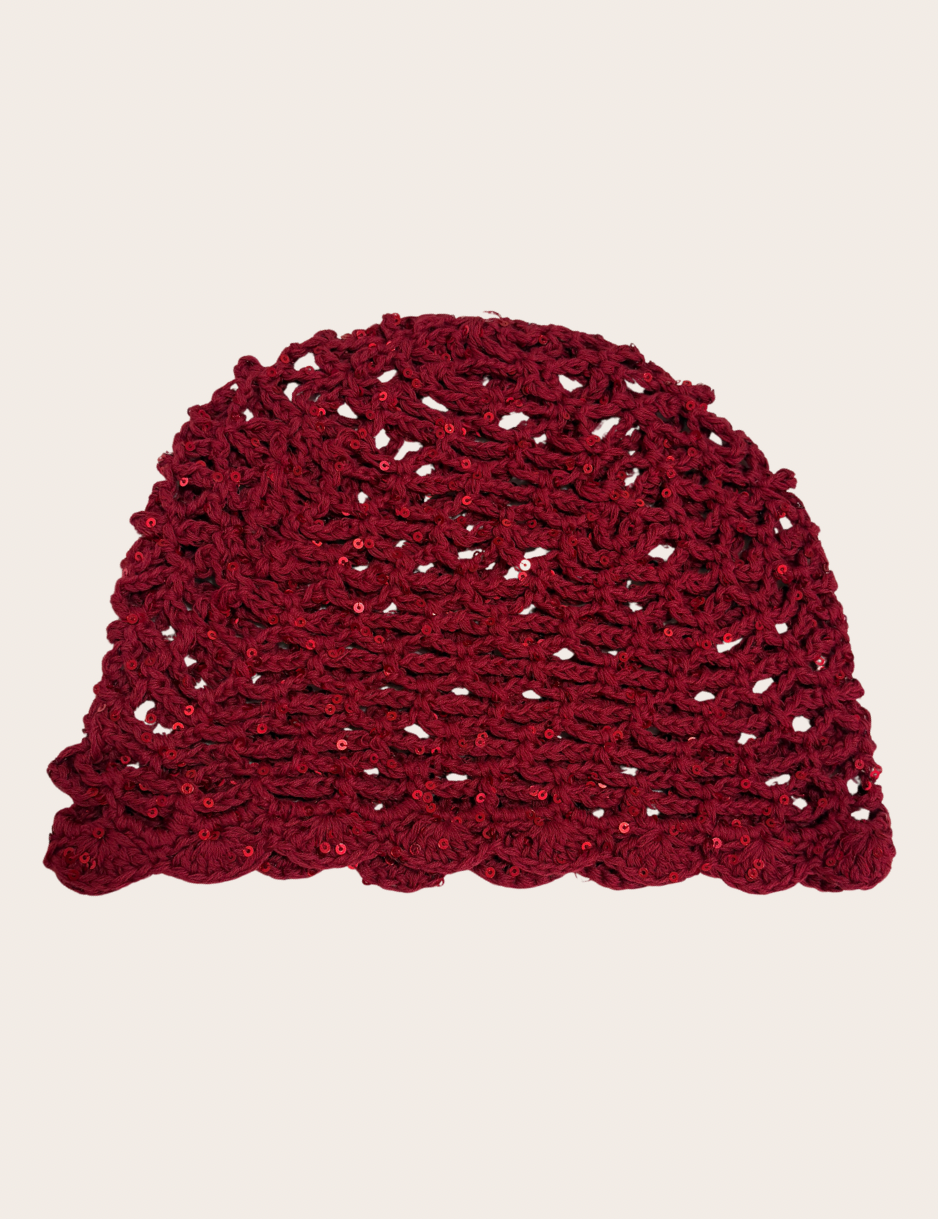 Red crochet hat with delicate glitter accents