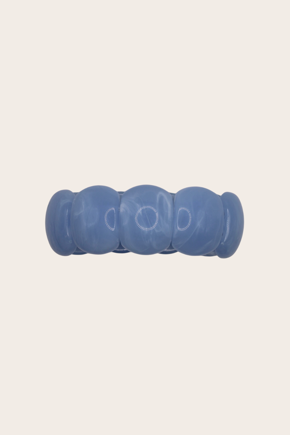 Gaia Blue Bracelet featuring translucent blue acrylic beads on an elastic design