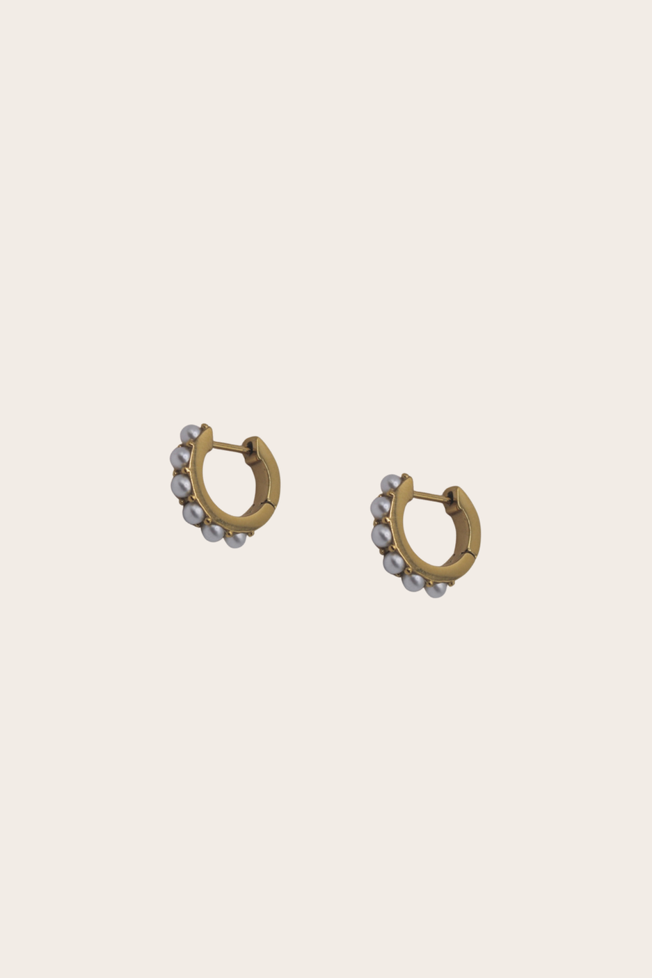 Dainty Pearls Huggies featuring small hoops with multicolor beaded drops