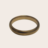 Indira Dainty Bangle, gold bangle featuring a slim, minimal silhouette with a polished finish
