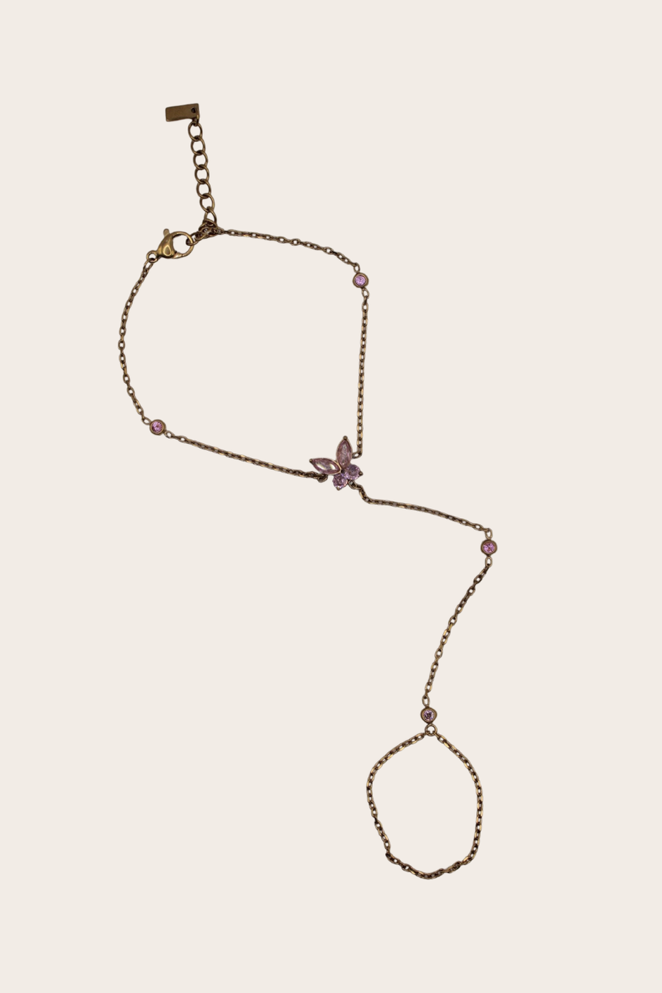 Pinky Butterfly Hand Chain featuring a bracelet-to-ring chain with a small pink butterfly detail