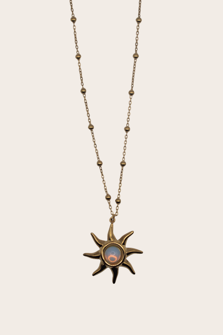 Opal Sun Necklace with radiant sun pendant and opal-inspired center