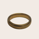 Indira Mid Bangle, gold bangle featuring a medium-width silhouette that balances presence with easy styling