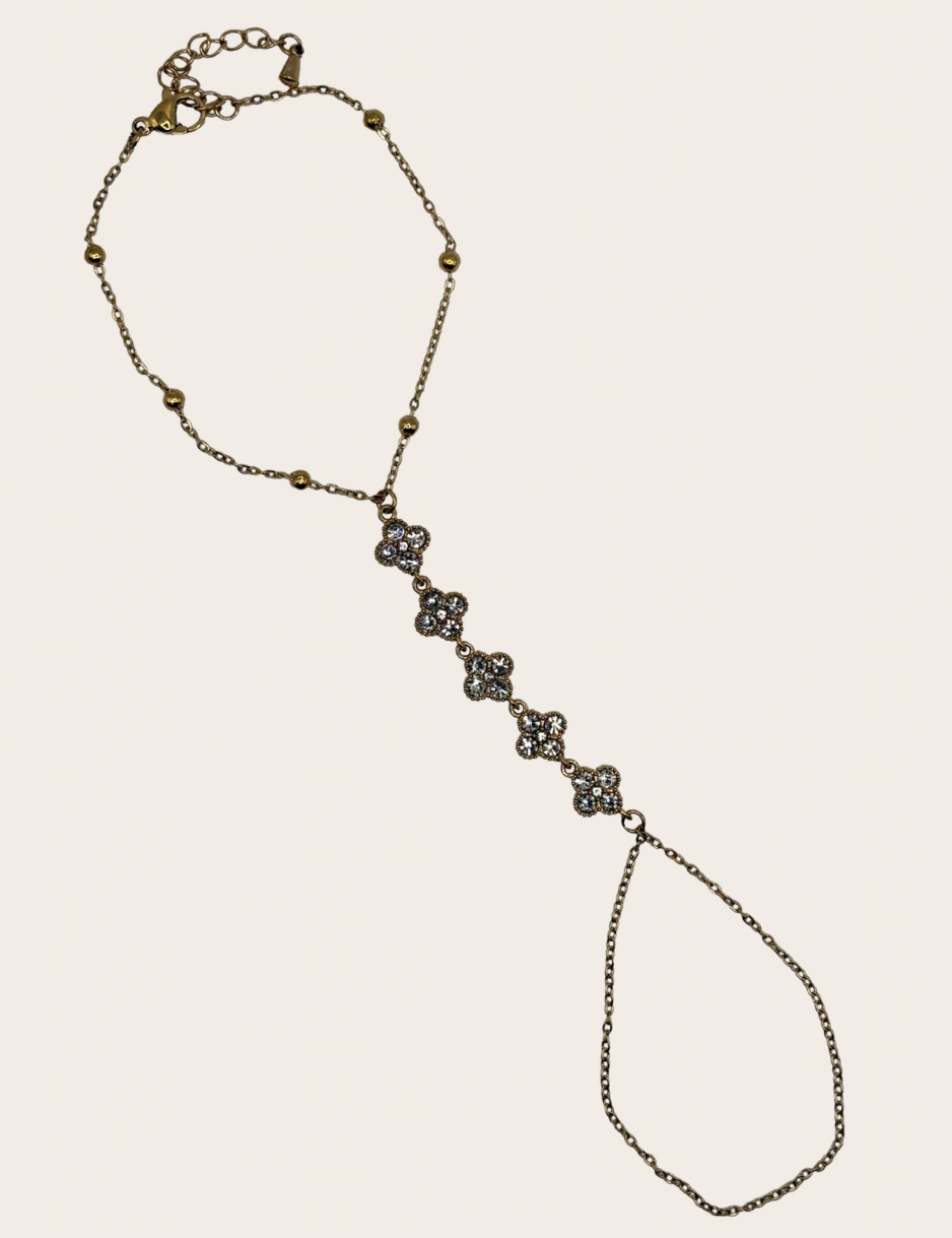 Stainless steel hand chain with sparkling clover-inspired details