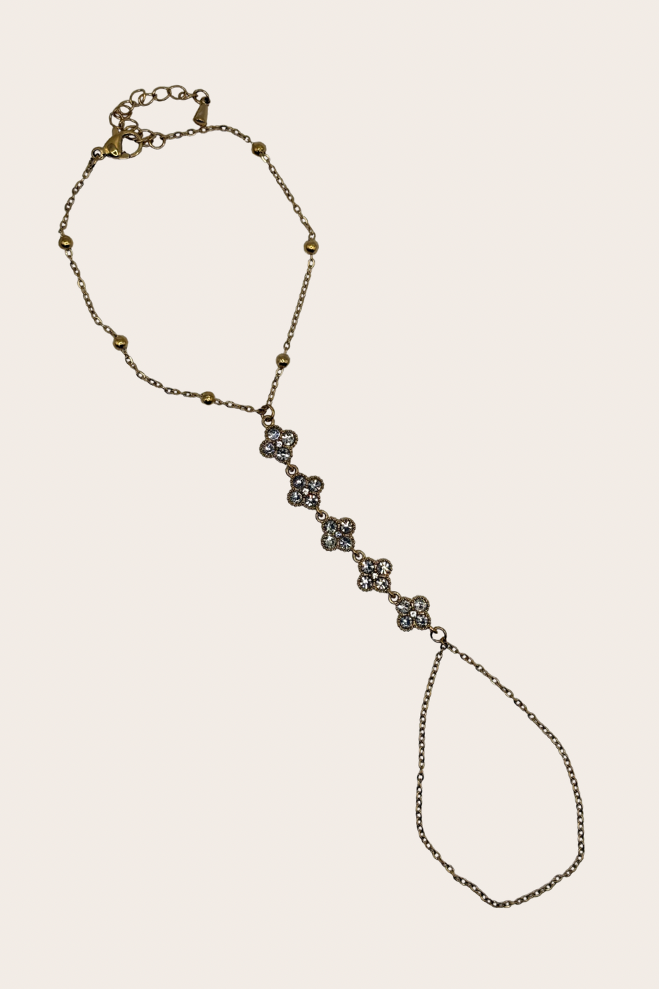 Stainless steel hand chain with sparkling clover-inspired details