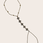 Stainless steel hand chain with sparkling clover-inspired details