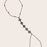 Stainless steel hand chain with sparkling clover-inspired details