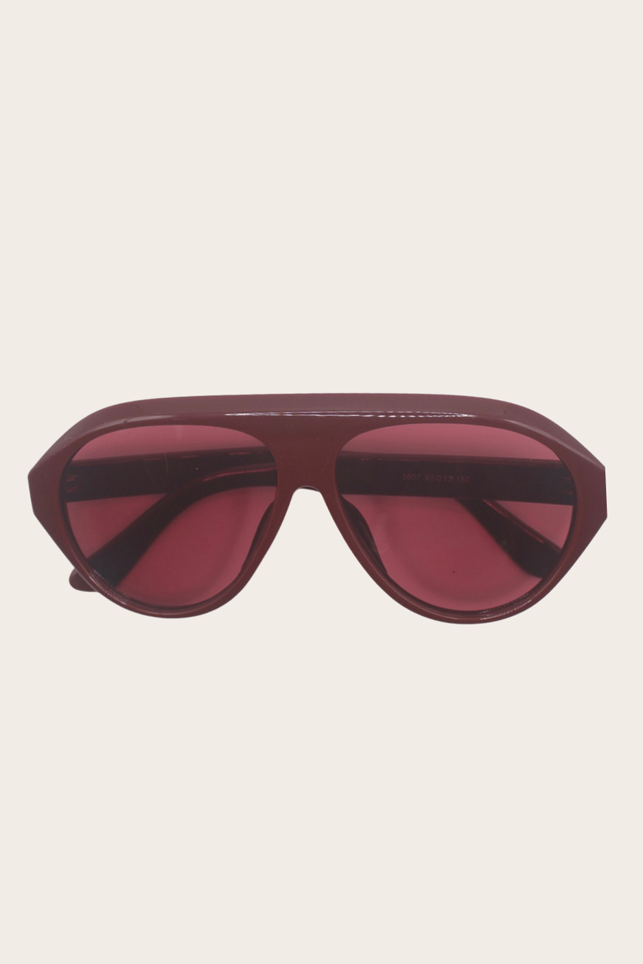 Savannah Burgundy Sunglasses featuring a slim printed cat-eye frame with blue lenses