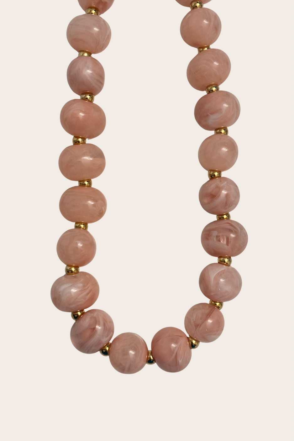 Paula Pinky Chunky Chain, gold and pink necklace featuring a chunky chain silhouette with playful pink accents