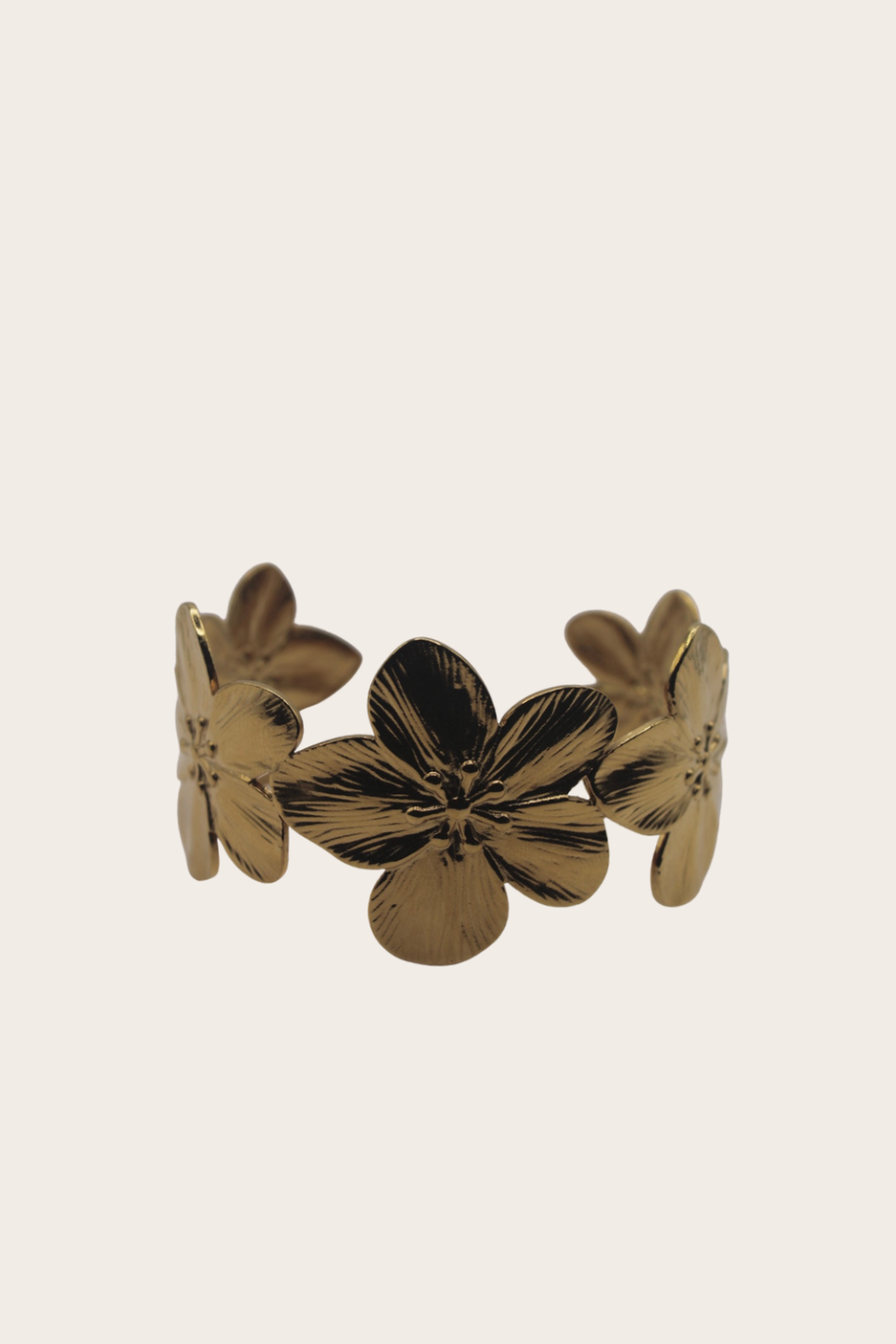 Aloha Cuff featuring an open cuff with layered floral and petal shapes