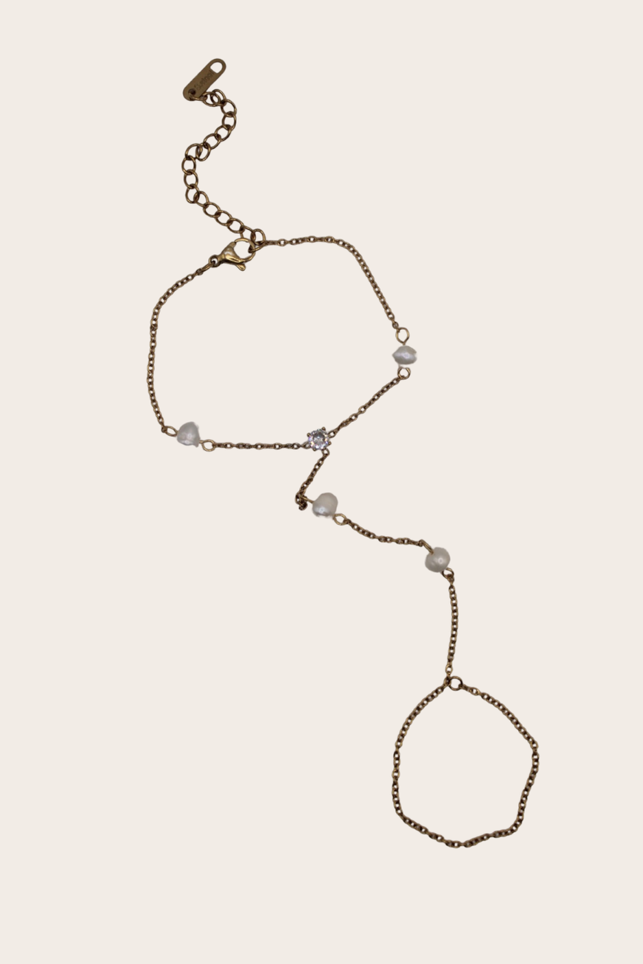 Diamond Pearls Hand Chain featuring a bracelet-to-ring chain with pearl-style and crystal-style accents