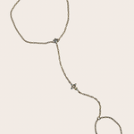 Dainty stainless steel hand chain with sparkling cross detail