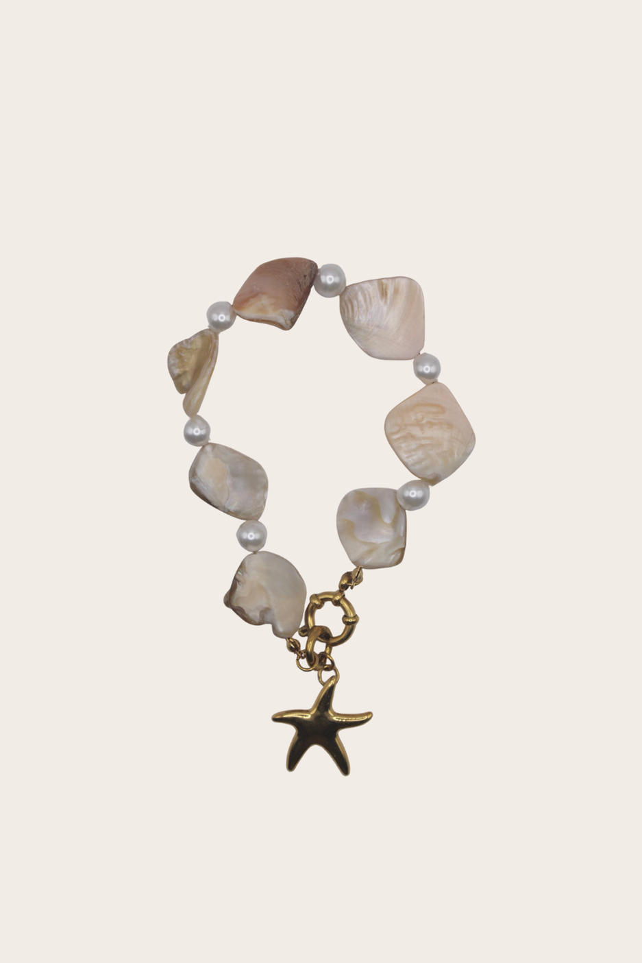 Ocean Pearls Starfish Bracelet featuring pearl-style beads with a dangling starfish charm