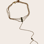Grace stainless steel hand chain with emerald-green detail