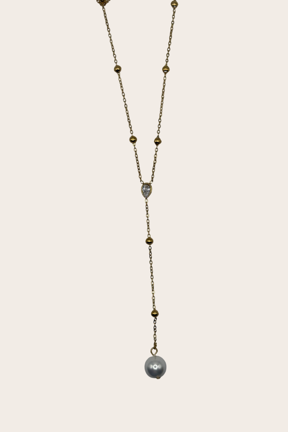Diamond Pearl Lariat, gold, pearl white and clear necklace with a lariat design combining pearl and sparkling diamond-inspired accents